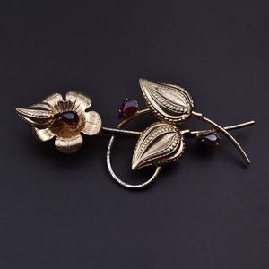 Gold flower brooch with ruby red rhinestones, art nouveau floral pin